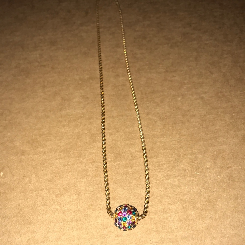 Necklace with gold chain and jewel-toned ball